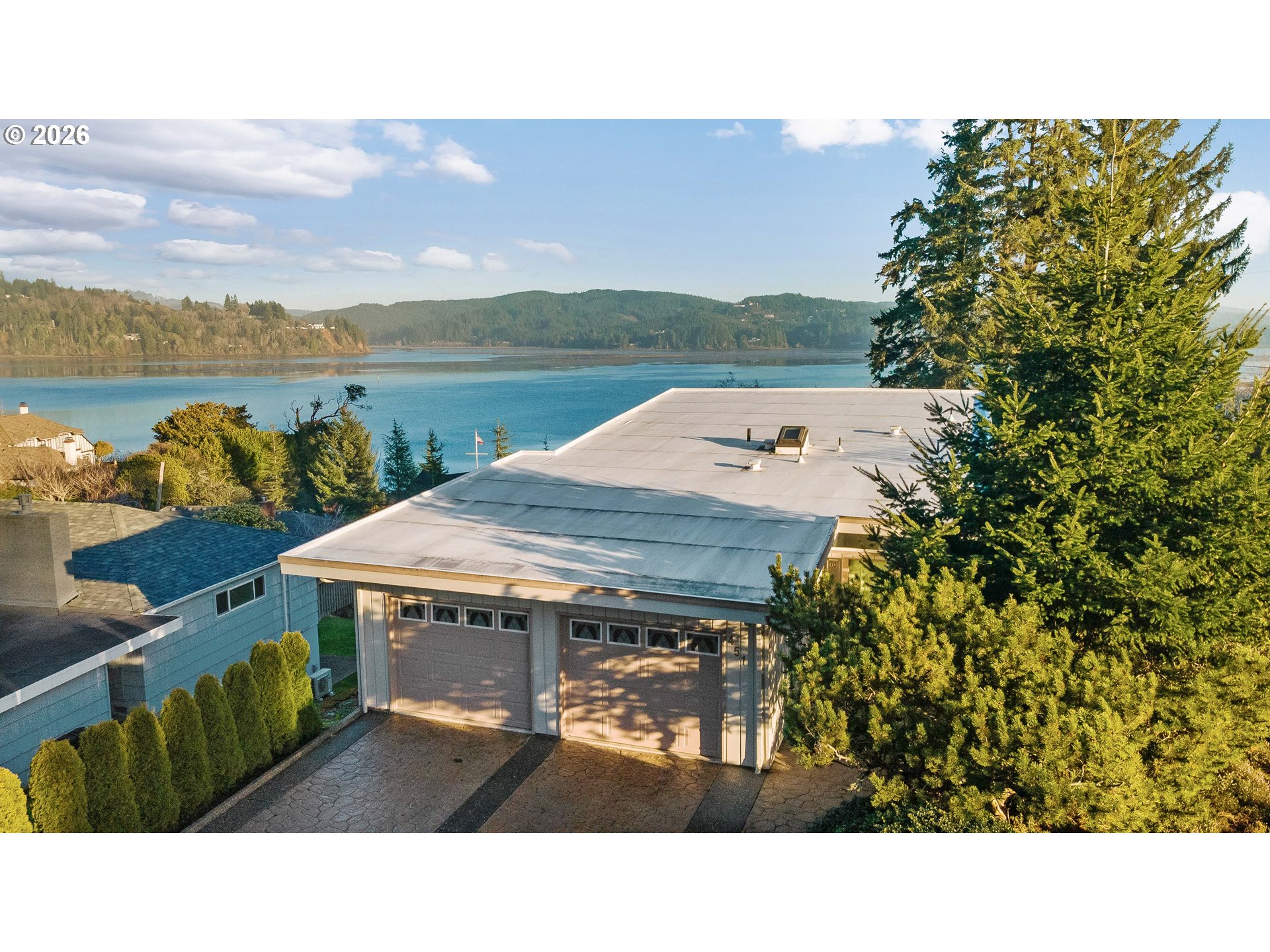 451 Simpson Avenue North Bend, OR 97459 - Photo 4 of 41 a view of a terrace with a table and chairs