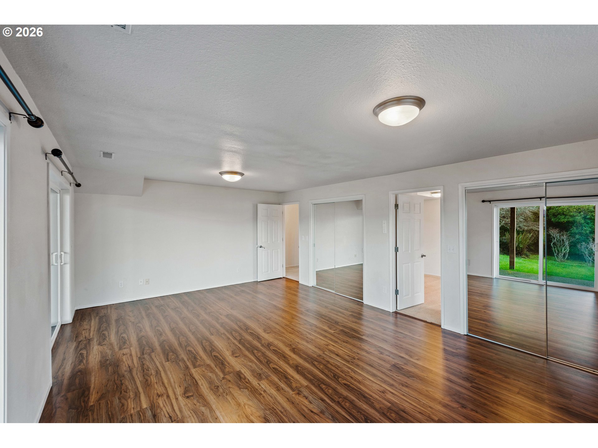 451 Simpson Avenue North Bend, OR 97459 - Photo 41 of 41 a view of an empty room with wooden floor and fan