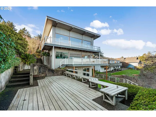 a view of a chairs and table on the wooden deck