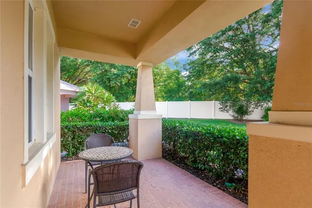a view of a chair and table in backyard