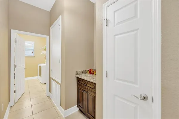a view of a kitchen from the hallway