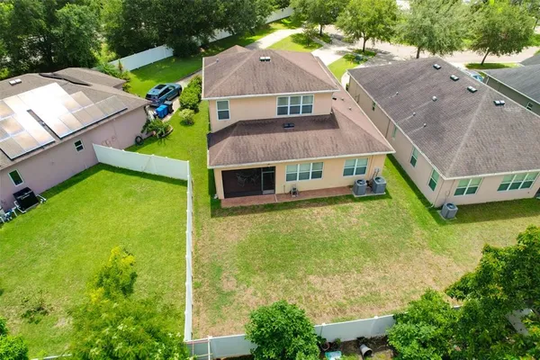 an aerial view of a house with a garden