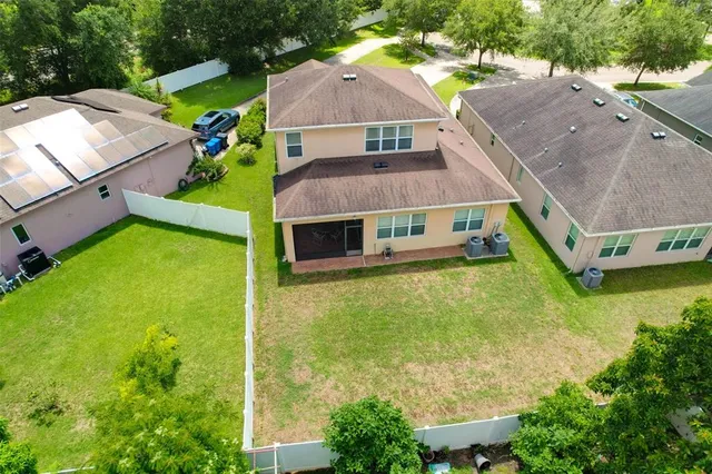 an aerial view of a house with a garden