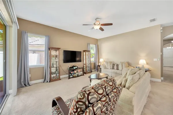 a view of a livingroom with furniture and a flat screen tv