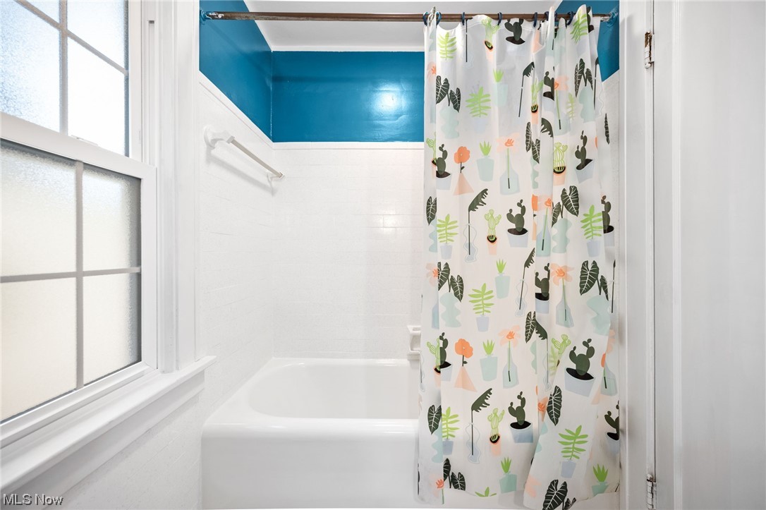 3962 Orchard Road Cleveland Heights, OH 44121 - Photo 26 of 35 Bathroom with shower / bath combo with shower curtain and a healthy amount of sunlight