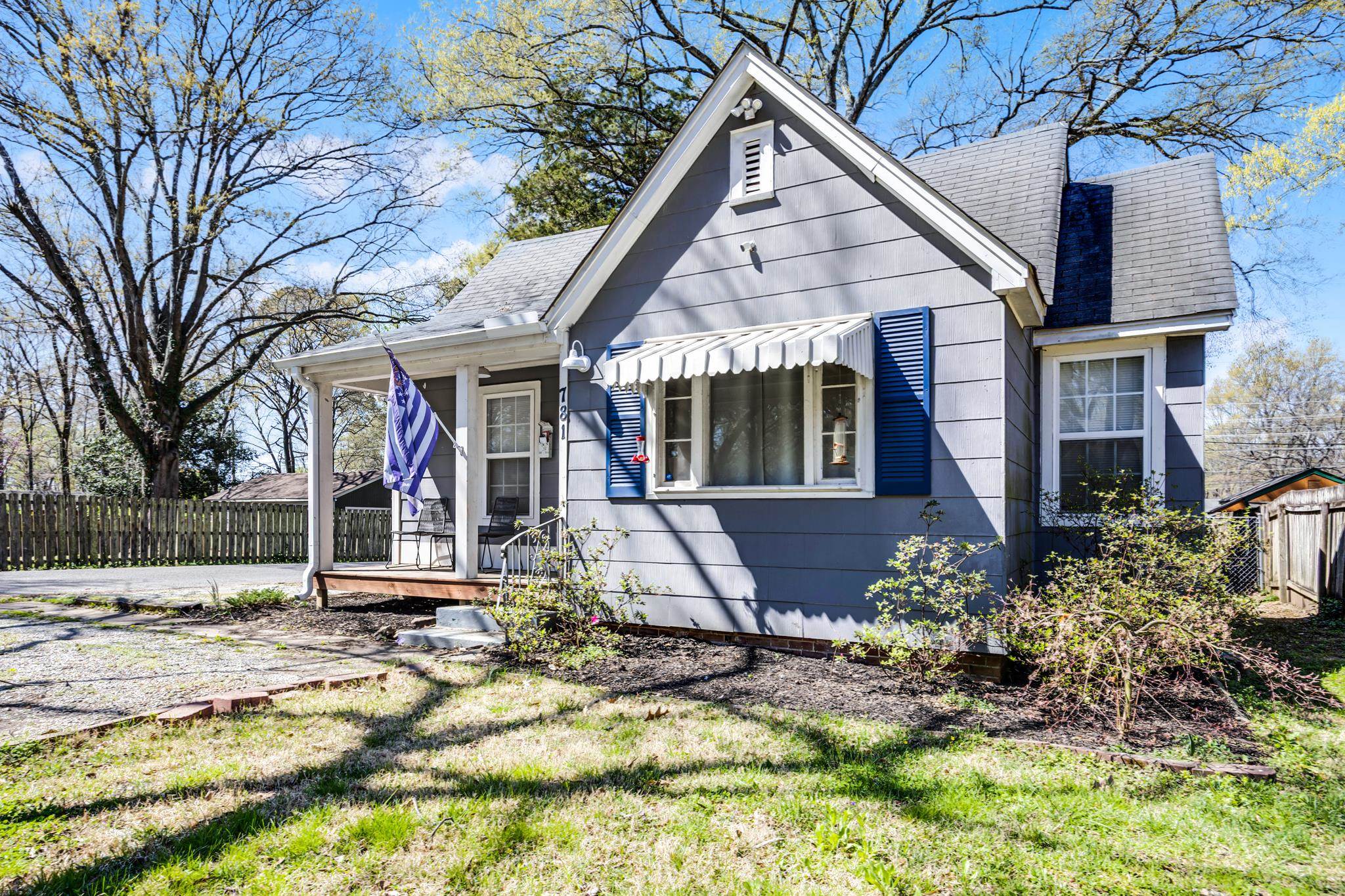 781 South Graham Street Memphis, TN 38111 - Photo 4 of 39 a view of a white house with large windows and a small yard