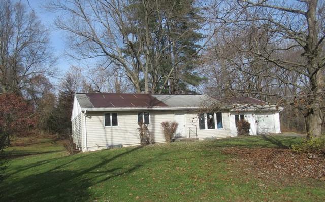 49 Hackensack Heights Road Wappingers Falls, NY 12590 - Photo 1 of 1 a front view of a house with a garden