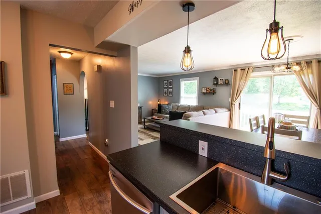 a view of a living room and bathroom