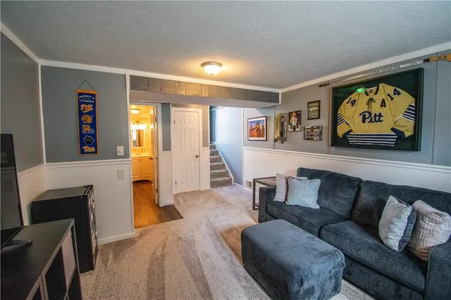 a bathroom with a toilet a sink and a mirror