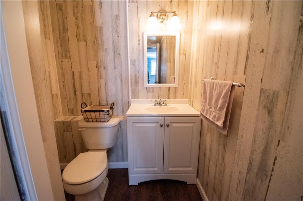 222 Carters Grove Drive Gibsonia, PA 15044 - Photo 18 of 27 a bathroom with a toilet a sink and a mirror
