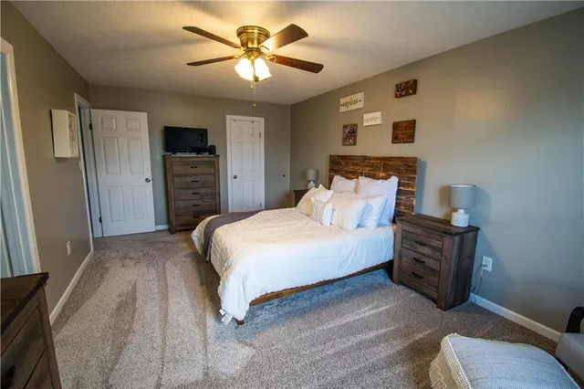 a bathroom with a sink toilet and mirror