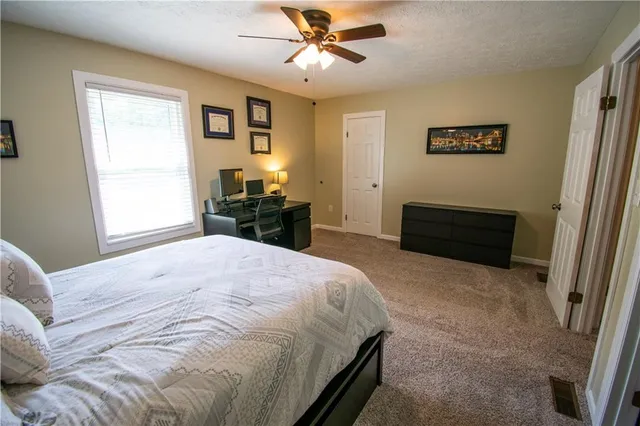 a bathroom with a sink toilet and a mirror