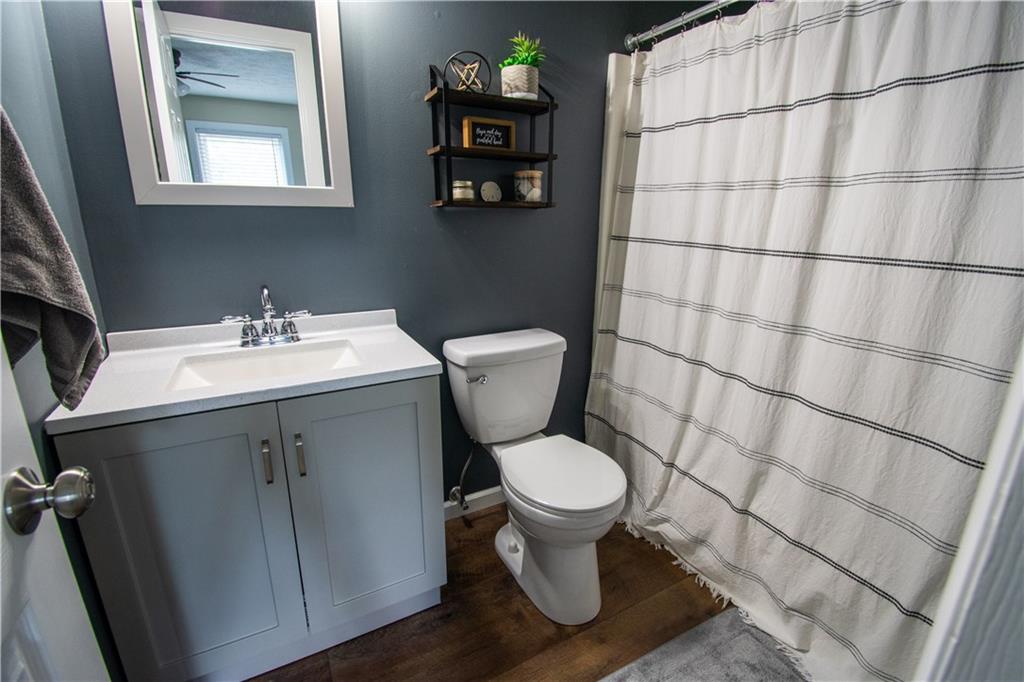 222 Carters Grove Drive Gibsonia, PA 15044 - Photo 25 of 27 a bathroom with a sink toilet and a mirror