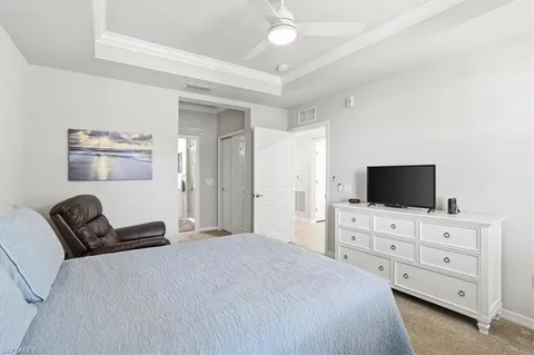 a bedroom with a bed and a couch