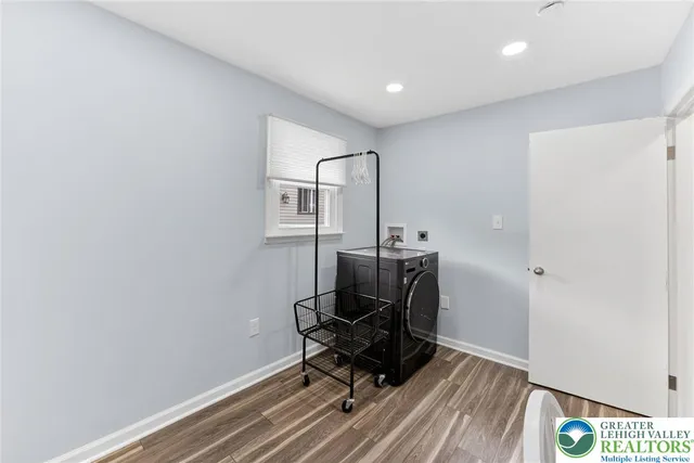 a view of workspace with wooden floor windows