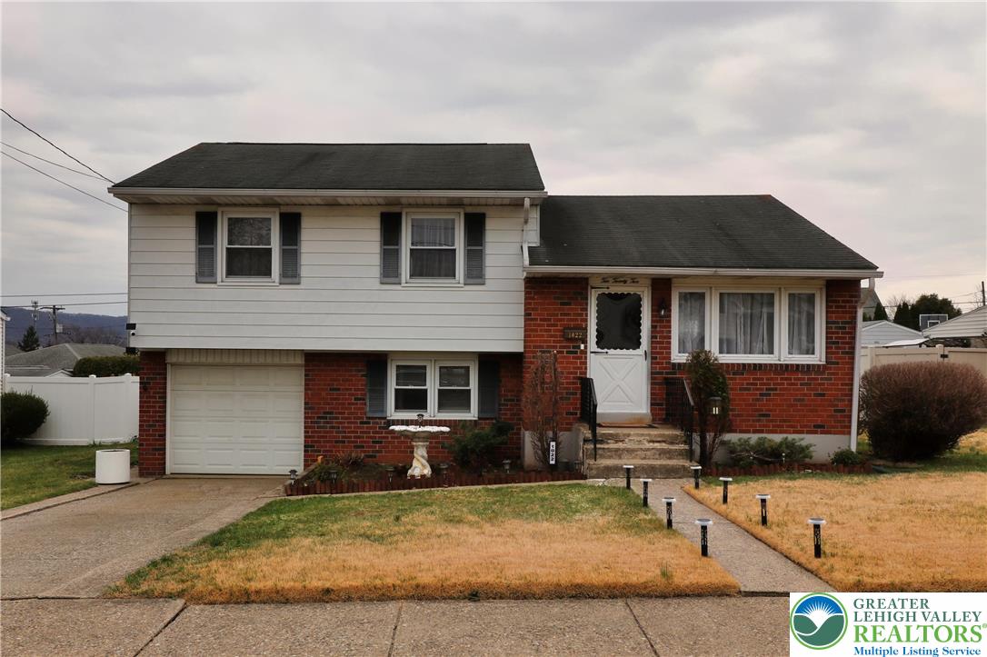 1022 Hilton Street Bethlehem, PA 18017 - Photo 1 of 35 a front view of a house with garden