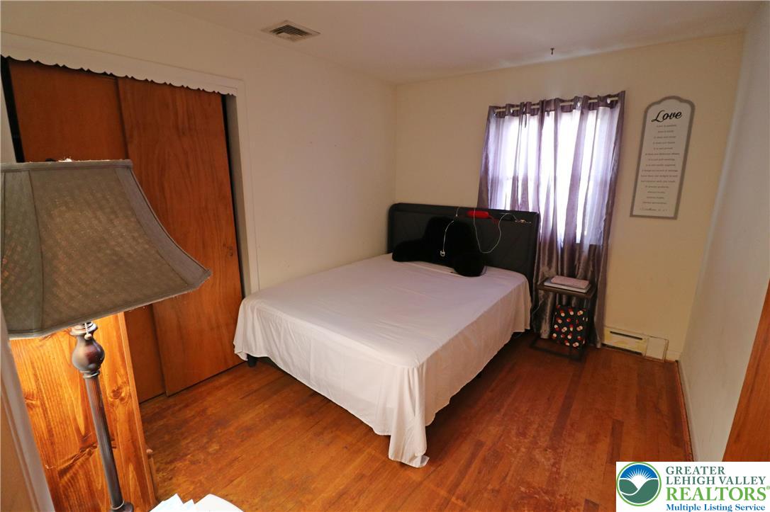 1022 Hilton Street Bethlehem, PA 18017 - Photo 16 of 35 a bedroom with a bed and a mirror