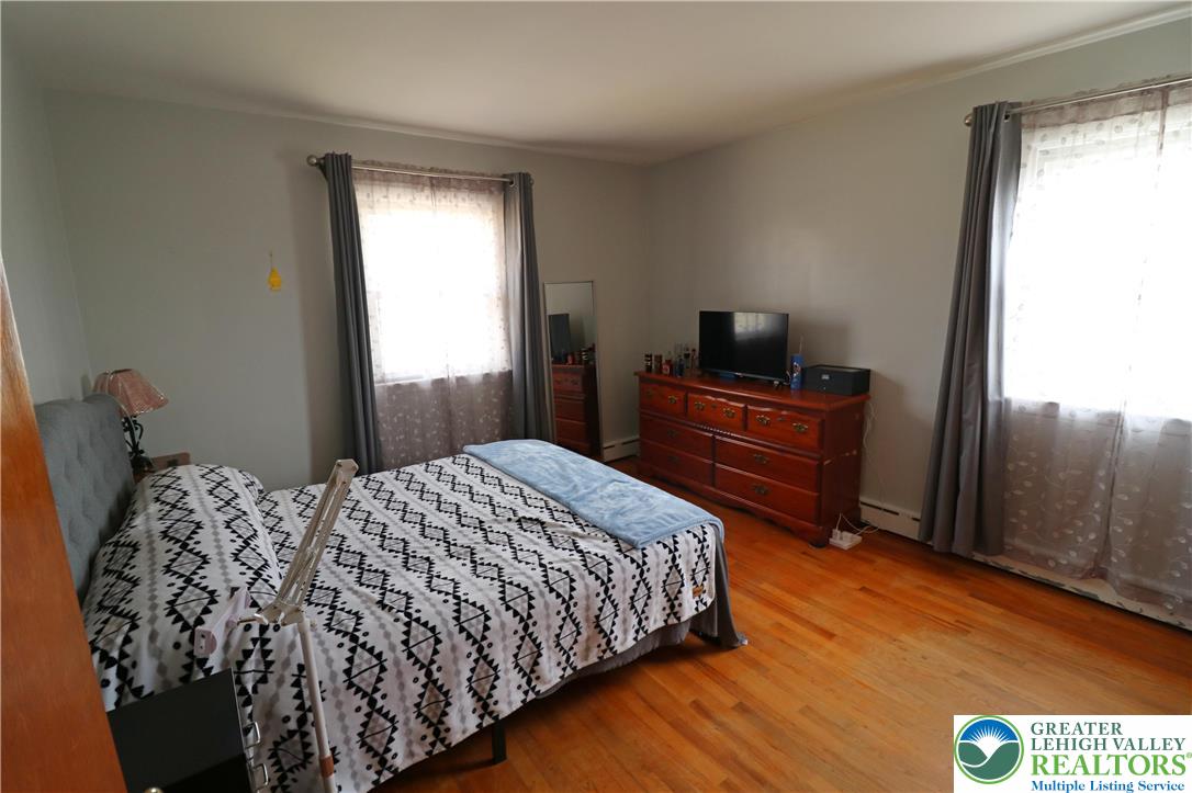 1022 Hilton Street Bethlehem, PA 18017 - Photo 18 of 35 a bedroom with a bed and a television