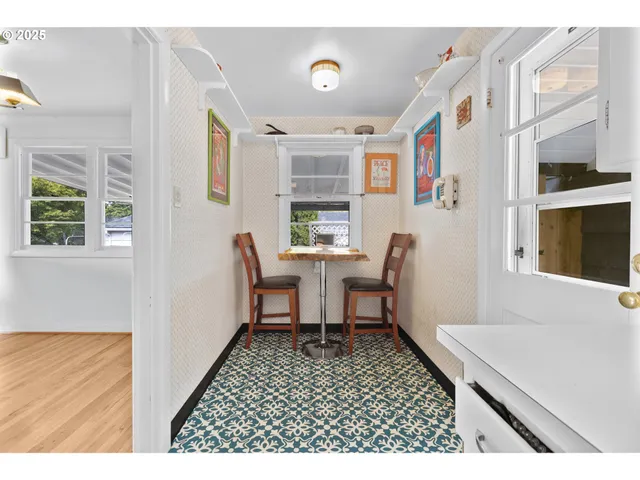 a balcony with furniture and a window