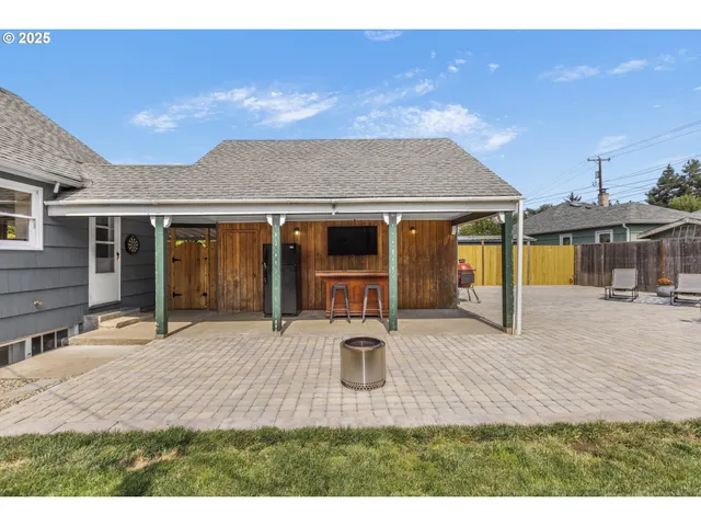 a front view of a house with yard and porch