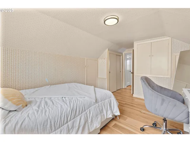 a view of a livingroom with furniture and stairs