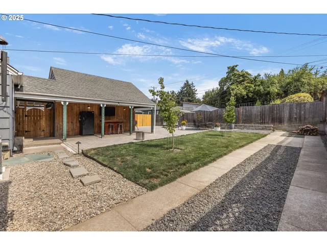 a view of a livingroom with furniture and staircase