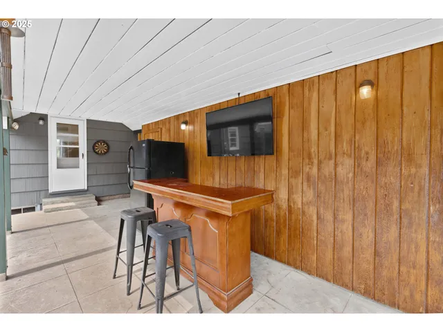 a view of a house with a swimming pool and a yard