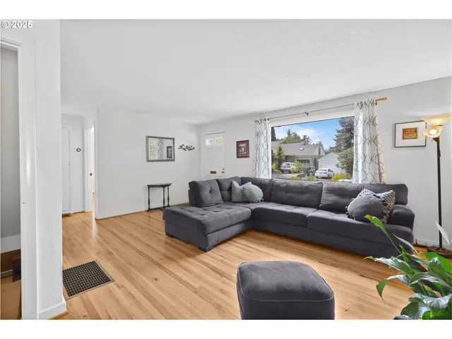 a living room with furniture and a rug
