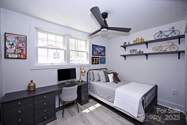 a bedroom with a bed and a desk