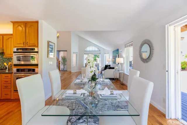 a kitchen with stainless steel appliances granite countertop a refrigerator and a stove