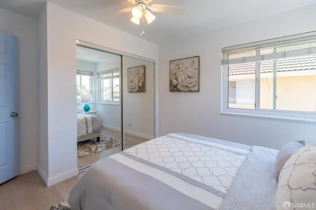 a front view of a house with a yard and a garden