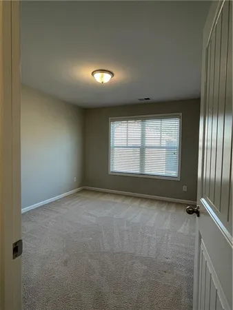 a white toilet sitting next to a bath tub