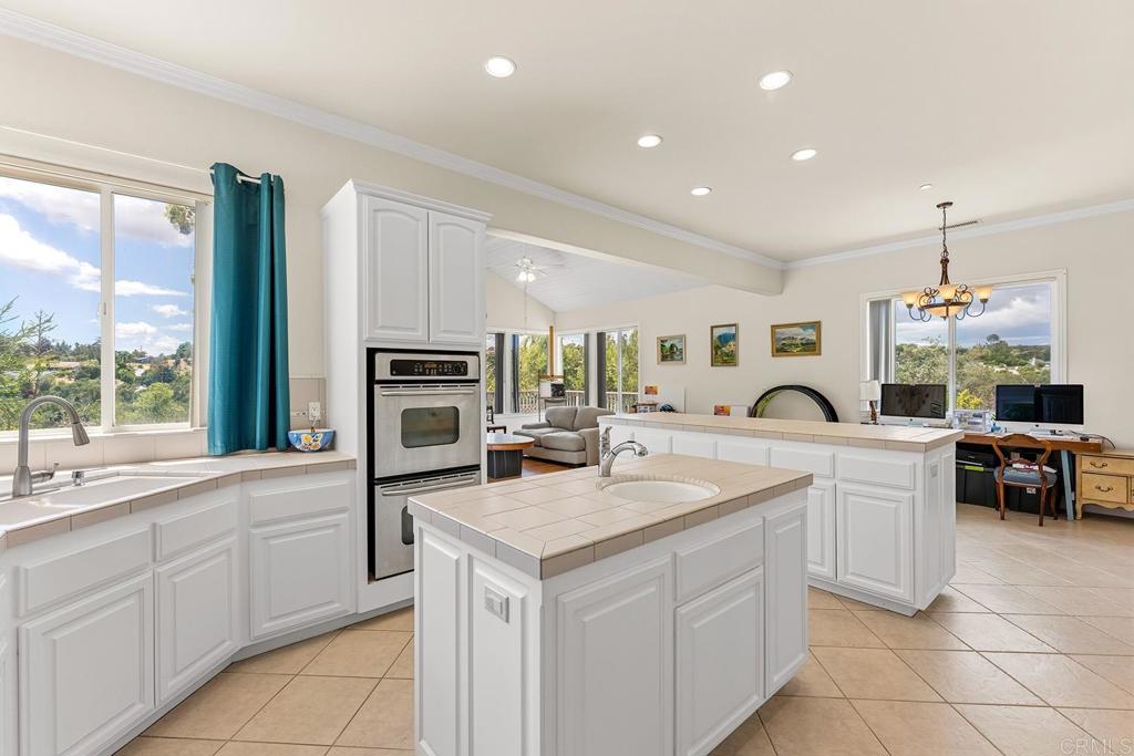 2557 Live Oak Park Road Fallbrook, CA 92028 - Photo 12 of 53 a kitchen with a sink stove and microwave