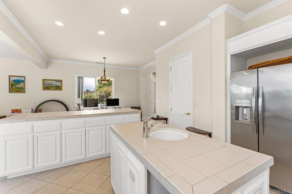 2557 Live Oak Park Road Fallbrook, CA 92028 - Photo 13 of 53 a spacious bathroom with a sink and a mirror
