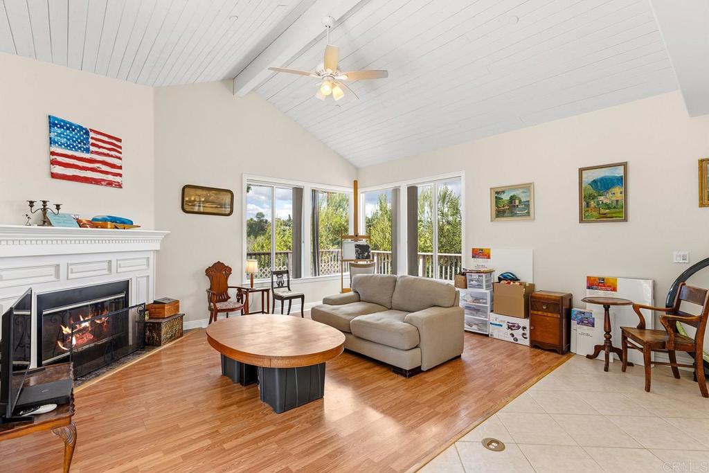 2557 Live Oak Park Road Fallbrook, CA 92028 - Photo 15 of 53 a living room with furniture a fireplace and a large window