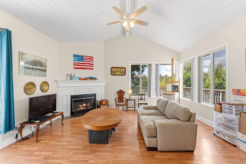 2557 Live Oak Park Road Fallbrook, CA 92028 - Photo 16 of 53 a living room with furniture and a fireplace