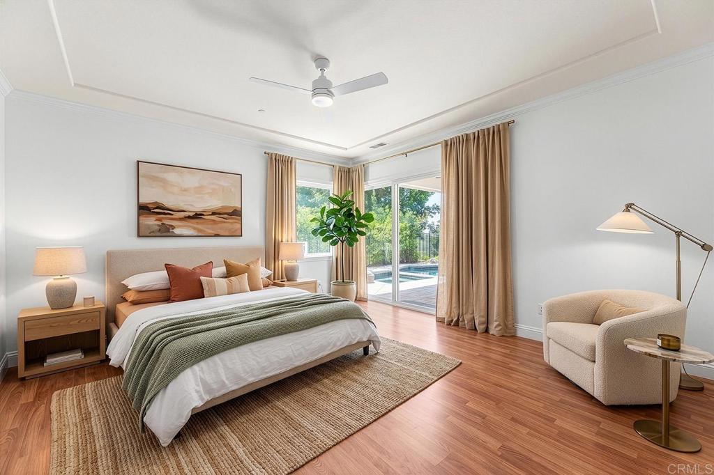 2557 Live Oak Park Road Fallbrook, CA 92028 - Photo 24 of 53 a spacious bedroom with a bed and a couch
