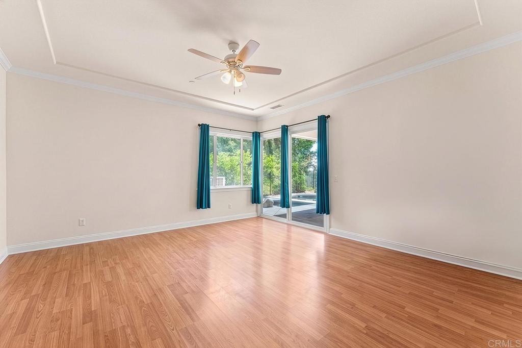 2557 Live Oak Park Road Fallbrook, CA 92028 - Photo 25 of 53 a view of an empty room with wooden floor and a window