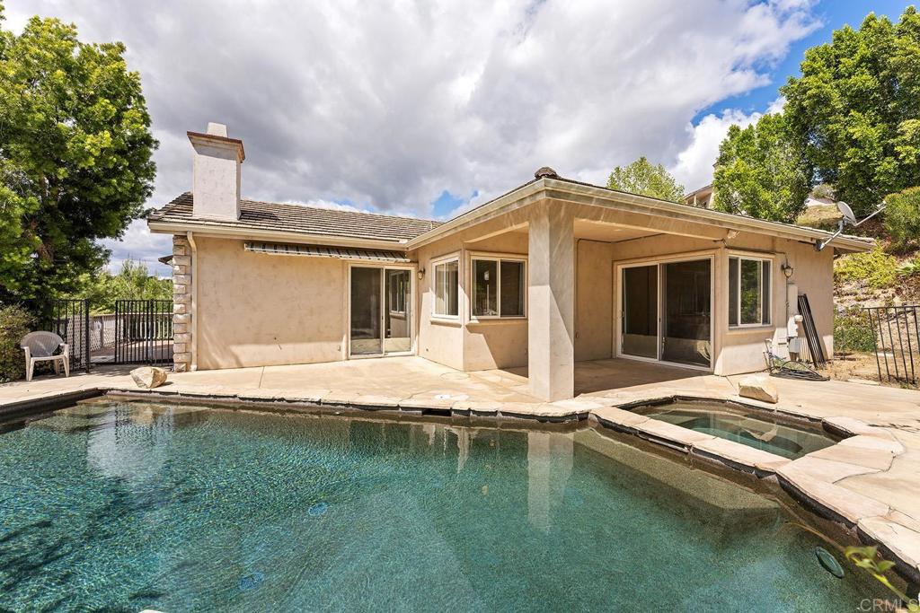 2557 Live Oak Park Road Fallbrook, CA 92028 - Photo 29 of 53 a swimming pool with outdoor seating and yard