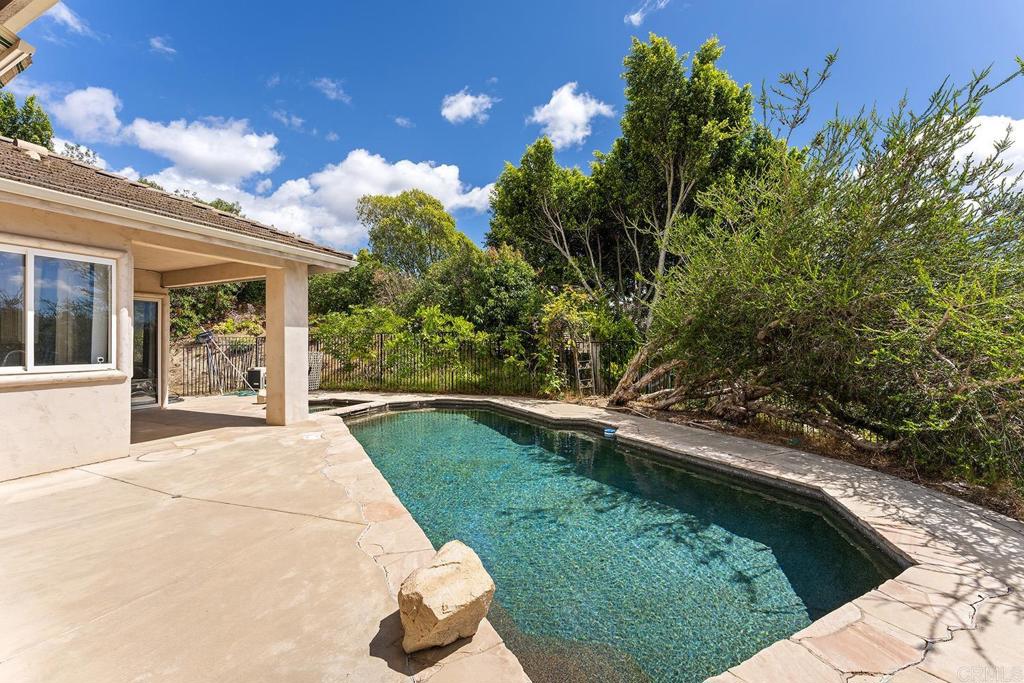 2557 Live Oak Park Road Fallbrook, CA 92028 - Photo 30 of 53 a view of backyard with swimming pool and outdoor seating