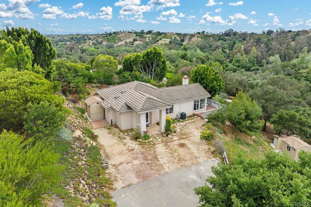 2557 Live Oak Park Road Fallbrook, CA 92028 - Photo 3 of 53 a view of a house with a yard