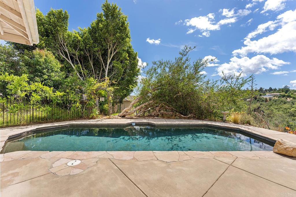 2557 Live Oak Park Road Fallbrook, CA 92028 - Photo 31 of 53 a view of backyard with swimming pool and outdoor seating