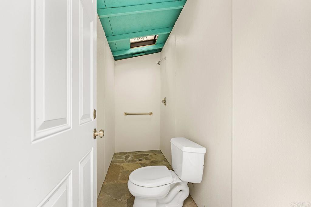 2557 Live Oak Park Road Fallbrook, CA 92028 - Photo 45 of 53 a bathroom with a toilet and a sink