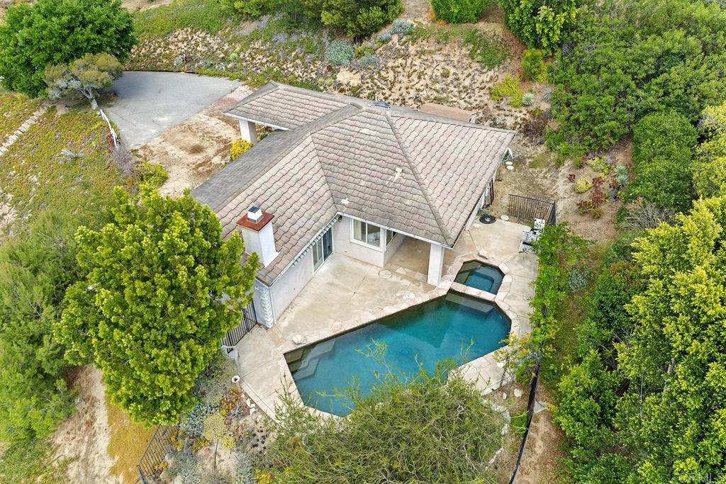 2557 Live Oak Park Road Fallbrook, CA 92028 - Photo 51 of 53 an aerial view of a house with a yard and large trees