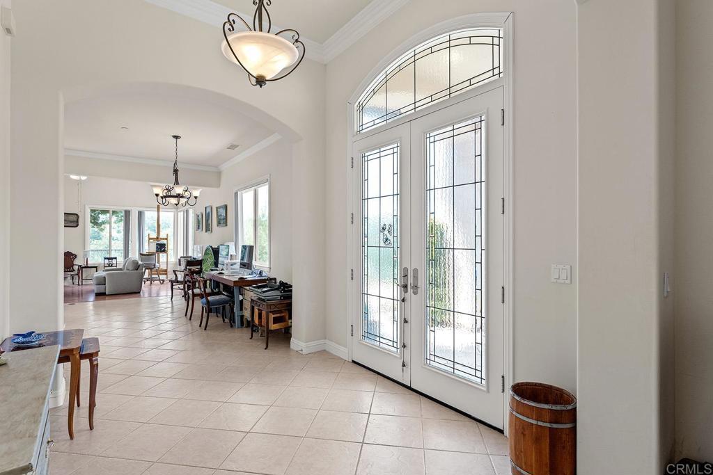 2557 Live Oak Park Road Fallbrook, CA 92028 - Photo 6 of 53 a dining room with furniture and a chandelier