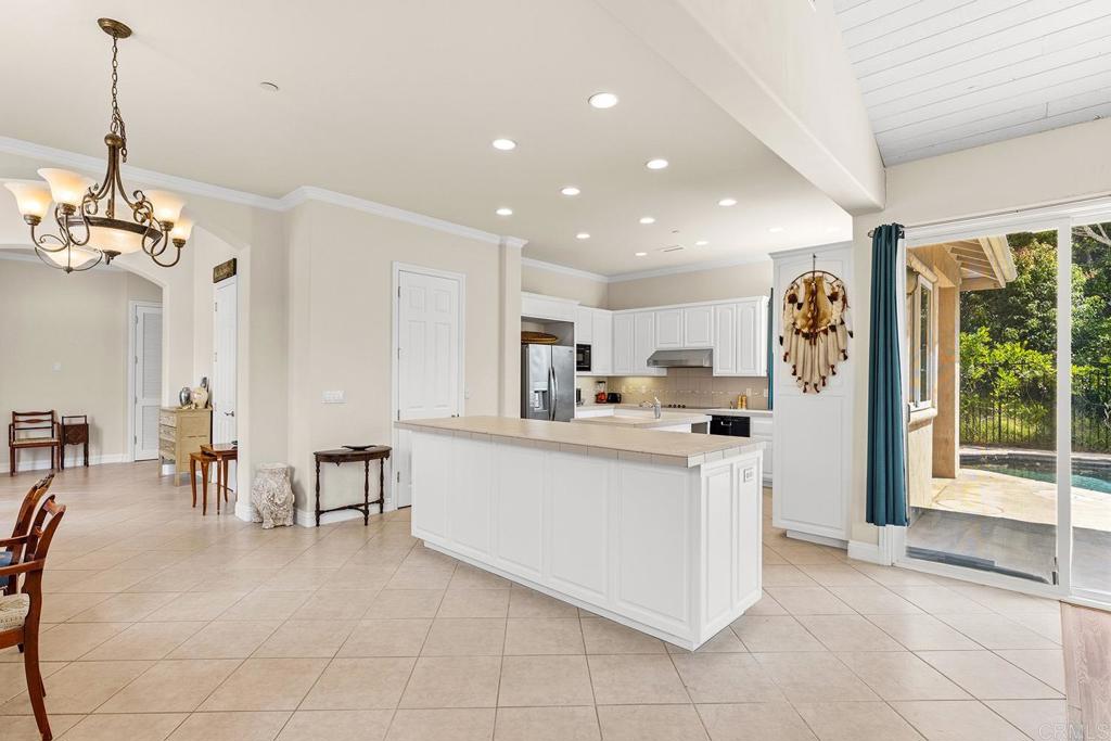 2557 Live Oak Park Road Fallbrook, CA 92028 - Photo 9 of 53 a living room with stainless steel appliances furniture and a open kitchen view