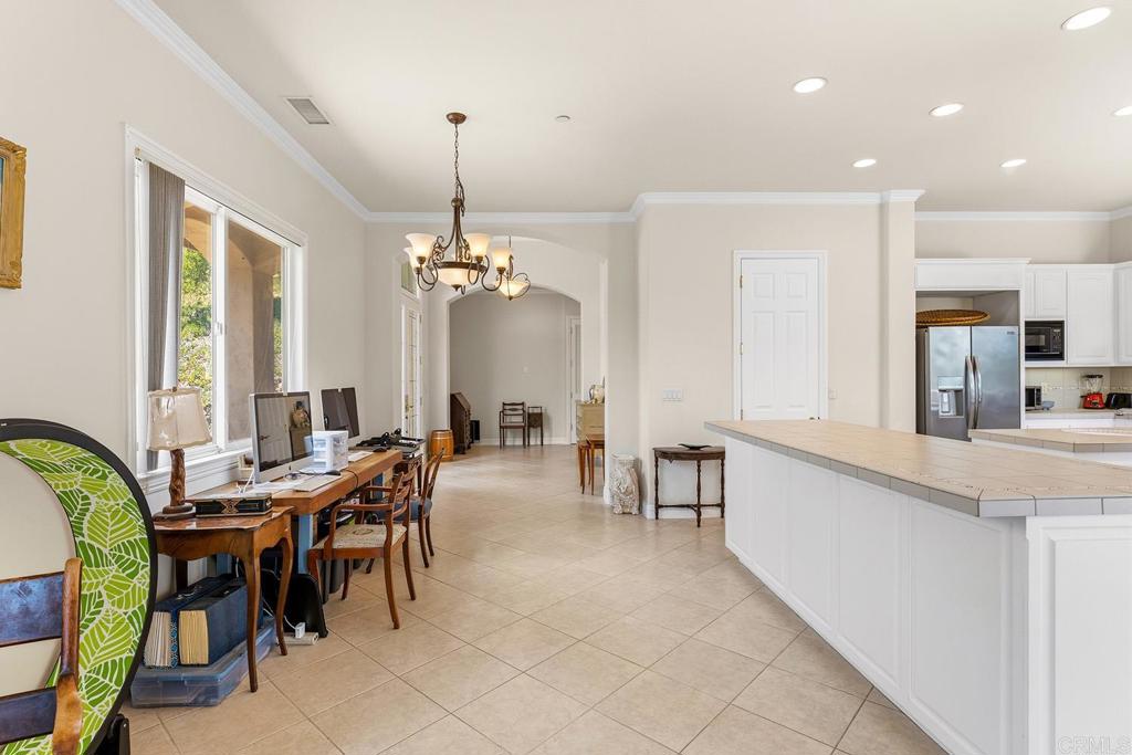 2557 Live Oak Park Road Fallbrook, CA 92028 - Photo 10 of 53 a view of a dining room with furniture and chandelier