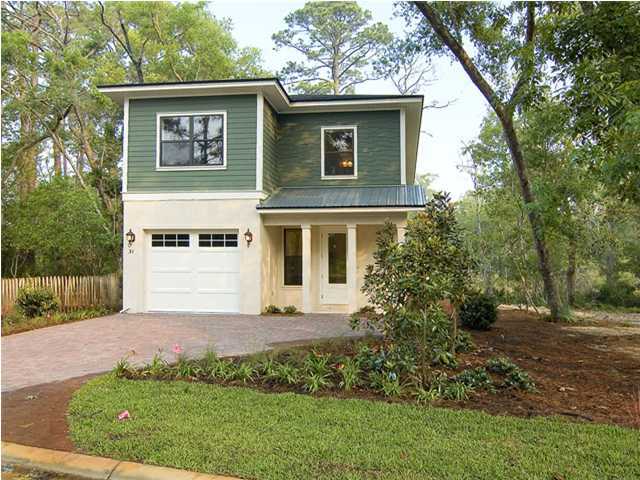 31 Beacon Point Drive Santa Rosa Beach, FL 32459 - Photo 1 of 18 a front view of a house with a garden