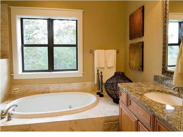 31 Beacon Point Drive Santa Rosa Beach, FL 32459 - Photo 8 of 18 a bathroom with a granite countertop sink and a bathtub next to a window