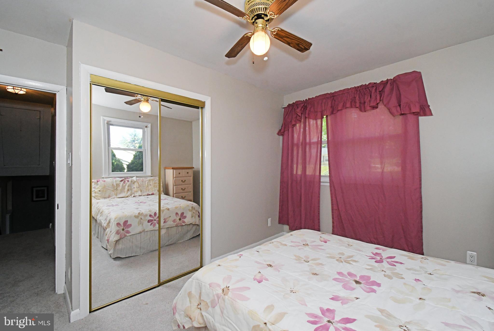 609 Mansfield Road Willow Grove, PA 19090 - Photo 24 of 68 a bedroom with a bed and large window